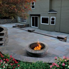 Lakeland sandstone fire pit kit in warm earthy tones, hand‑chiseled natural stone for outdoor living and backyard gatherings.